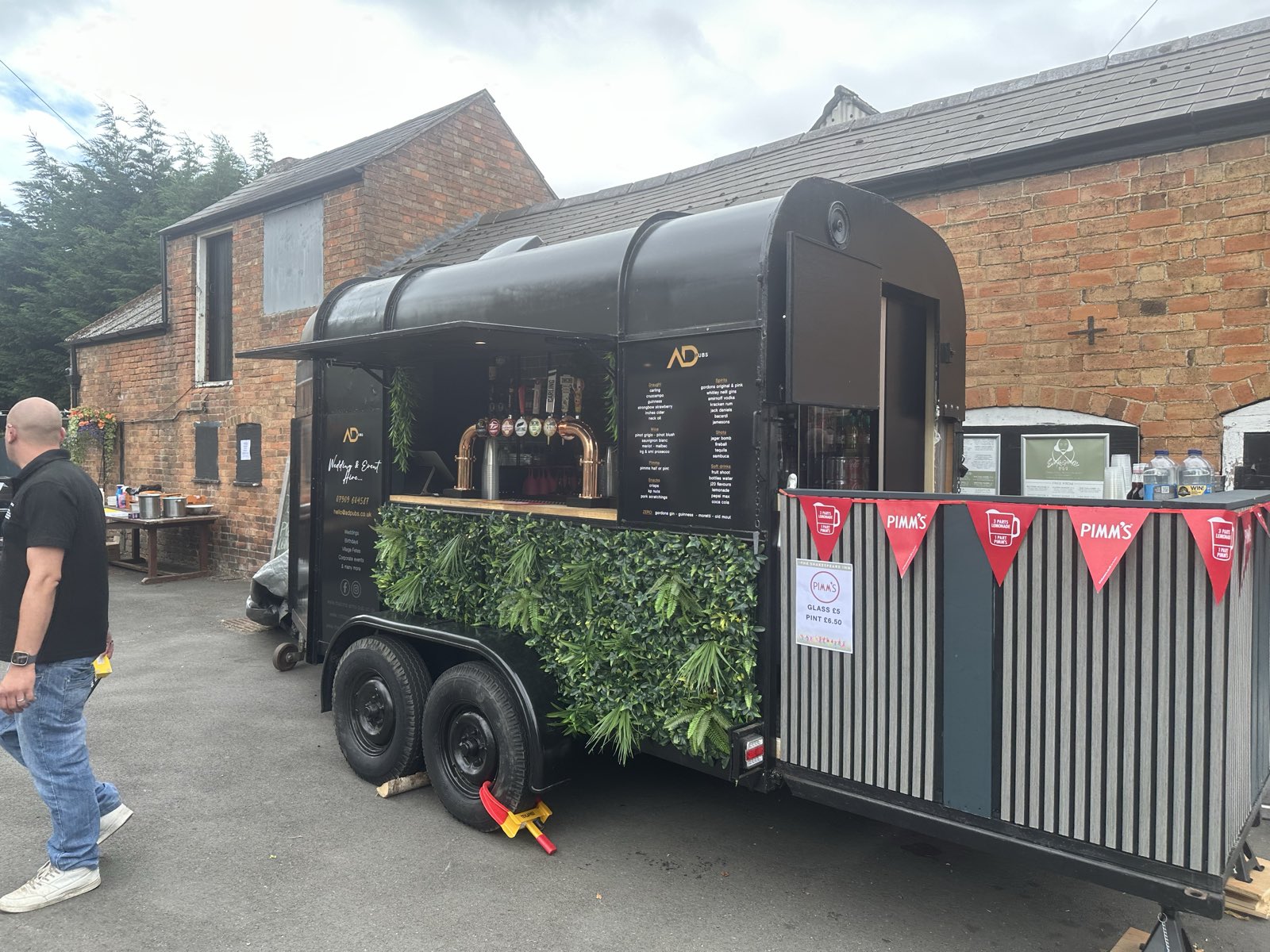 The ADevents converted horsebox bar set up at an outdoor event.